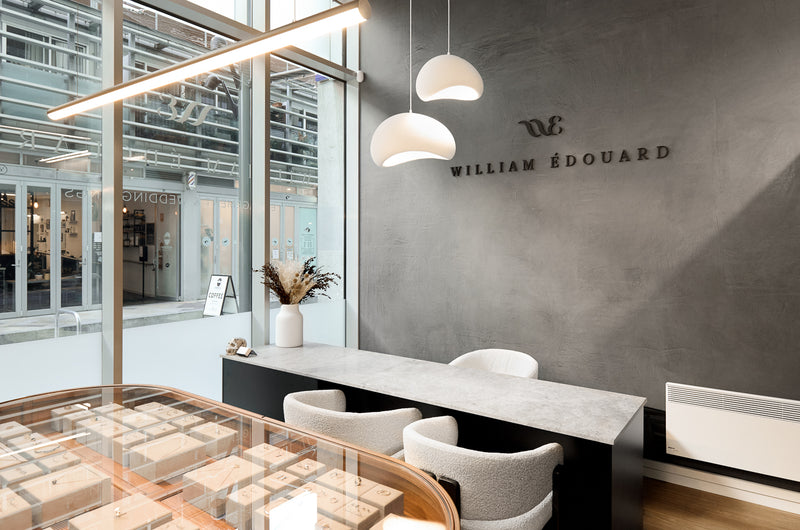 Luxury jewellery showroom interior with consultation desk and display cases at William Edouard boutique