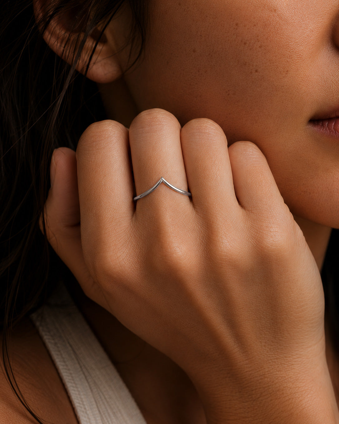 Minimalist yellow gold chevron stacking ring on hand by William Edouard